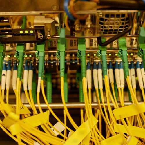 Background image of neat cable arrangement in server cabinet, copy space